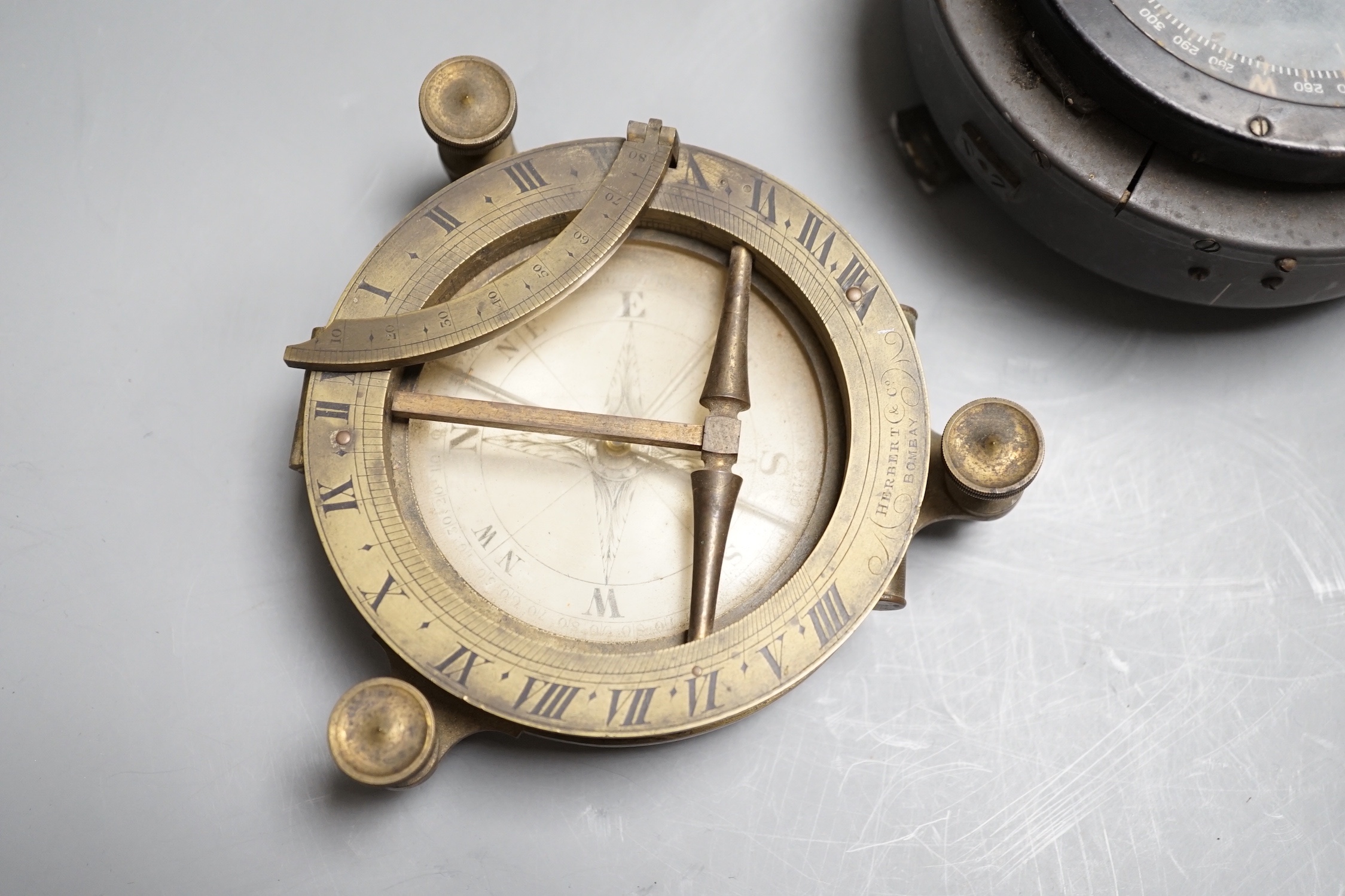 A 19th century Herbert & Co. brass compass and another WWII compass
